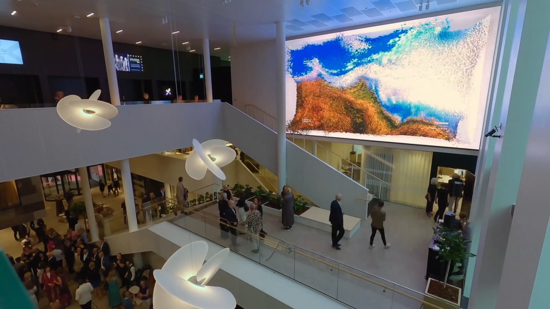 Moments in Time, permanent data sculpture by Ronen Tanchum and Phenomena Labs at Science Park Towers, Jonkoping, Sweden. Atrium crowd viewing Dreams of Nature chapter